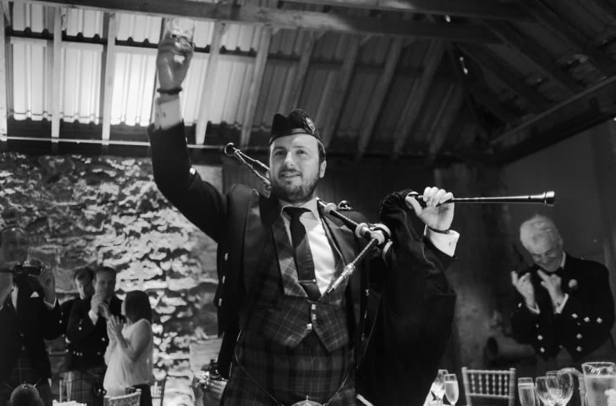 Toasting after a bagpipe performance at a Burns Supper