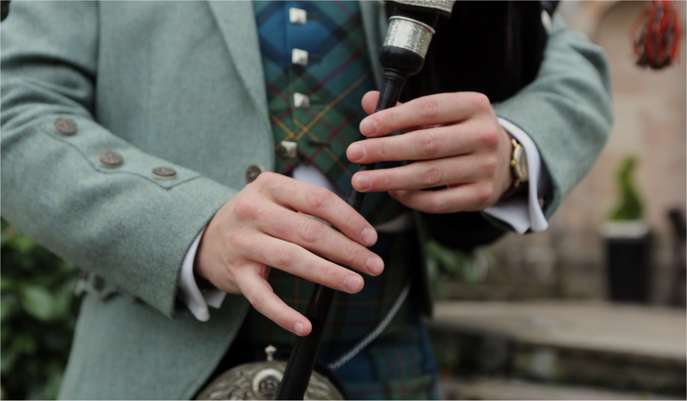 Close up shot of piper hands, Philip Barlow, while playing the bagpipes